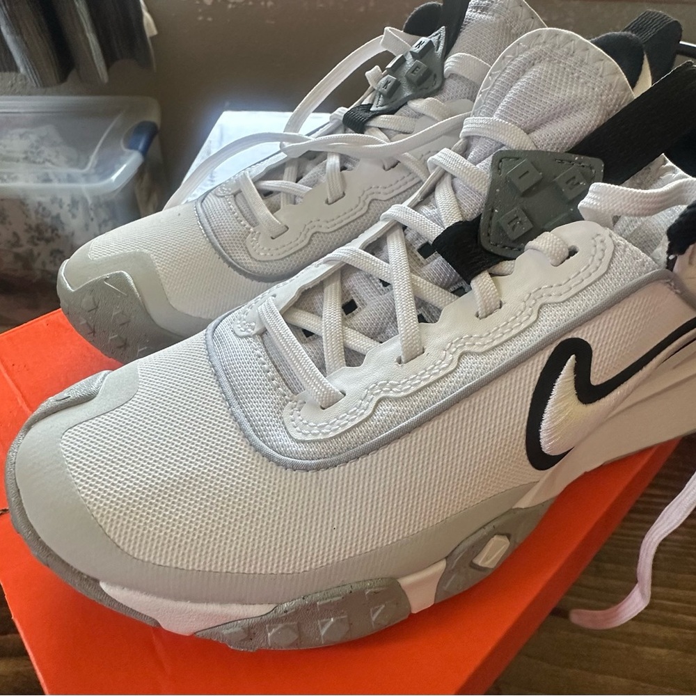 Nike White and Gray Athletic Turf Shoes with Sleek Design
